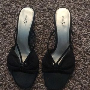 Black heels with a bow on them